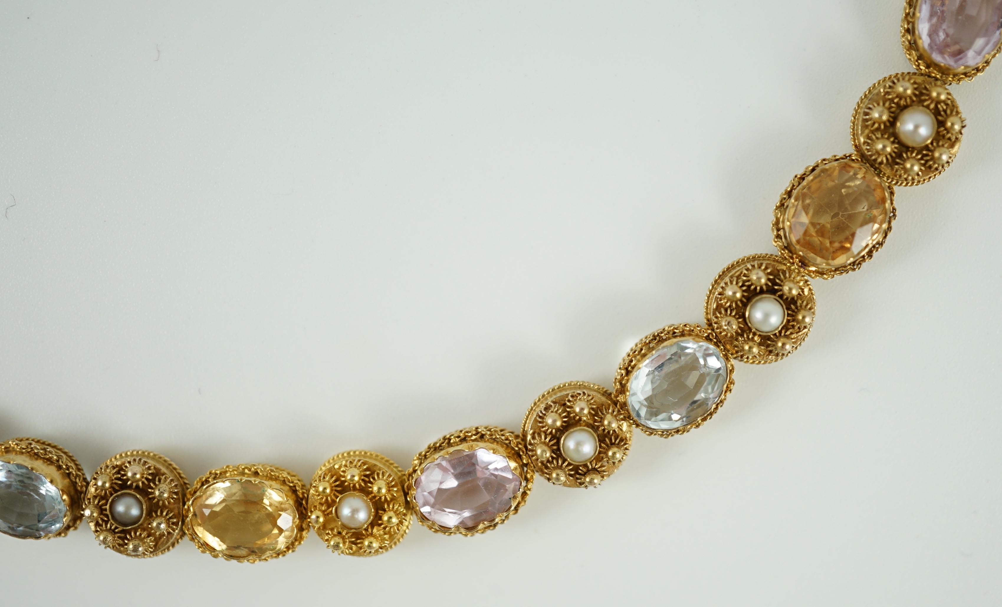 A 19th century gold, pink topaz, seed pearl, citrine and aquamarine set choker necklace
